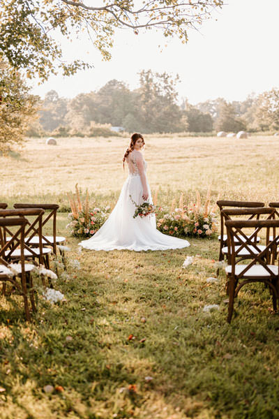 Bride posing at the end of the isle